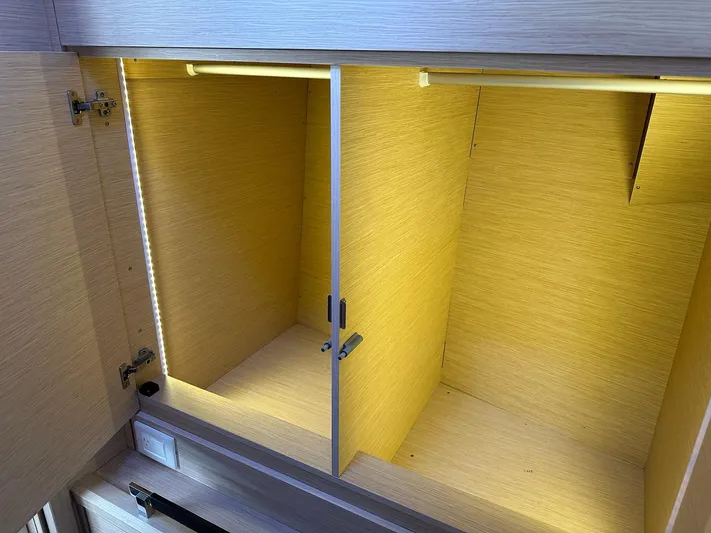  Yacht Photos Pics Empty wooden cabinet with LED lighting inside a 2018 Jeanneau 51 yacht.