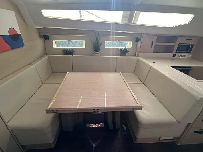  Yacht Photos Pics Interior of 2018 Jeanneau 51 yacht with modern seating and dining area.