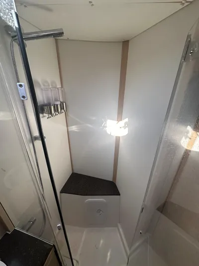  Yacht Photos Pics Shower area in 2018 Jeanneau 51 yacht with modern fixtures and seating.