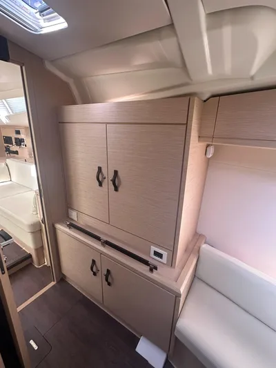  Yacht Photos Pics Interior of 2018 Jeanneau 51 yacht with modern cabinetry and seating.