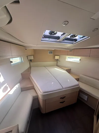  Yacht Photos Pics Luxurious interior of a 2018 Jeanneau 51 yacht with a spacious double bed.