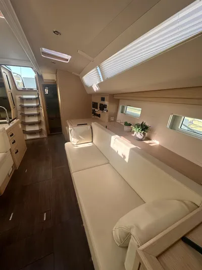  Yacht Photos Pics Interior of 2018 Jeanneau 51 yacht with modern furnishings and natural light.