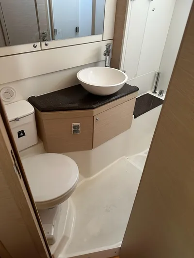  Yacht Photos Pics 2018 Jeanneau 51 yacht bathroom with modern sink and toilet.