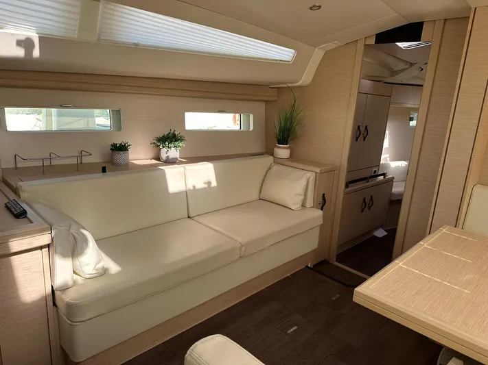  Yacht Photos Pics Luxurious interior of a 2018 Jeanneau 51 yacht with elegant seating and decor.