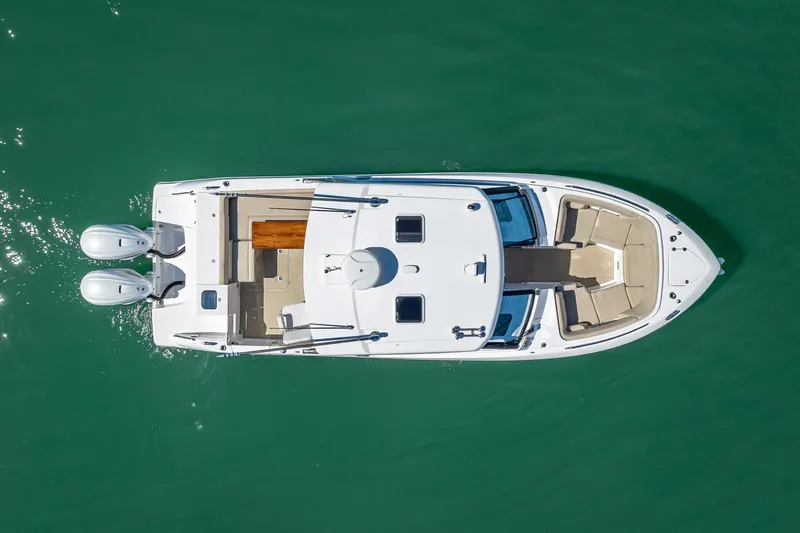 Kashmir Yacht Photos Pics Overhead view of 2019 Everglades 340 Dual Console boat on green water.