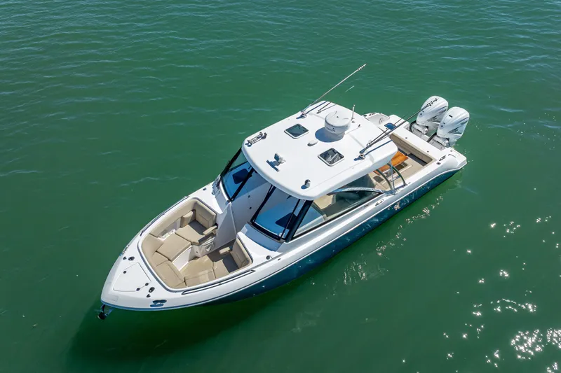 Kashmir Yacht Photos Pics 2019 Everglades 340 Dual Console boat on clear water, aerial view.