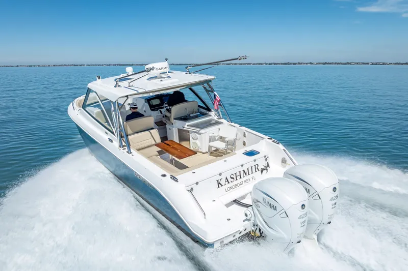Kashmir Yacht Photos Pics 2019 Everglades 340 Dual Console boat cruising on clear blue water.