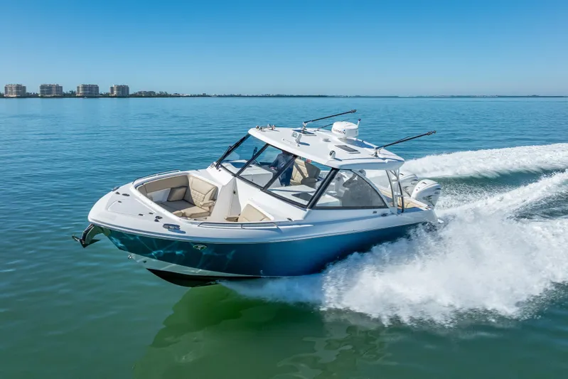 Kashmir Yacht Photos Pics 2019 Everglades 340 Dual Console boat cruising on clear blue water.