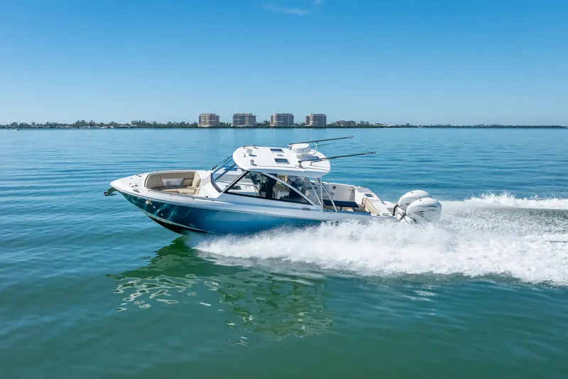 Kashmir Yacht Photos Pics 2019 Everglades 340 Dual Console boat cruising on calm blue water.