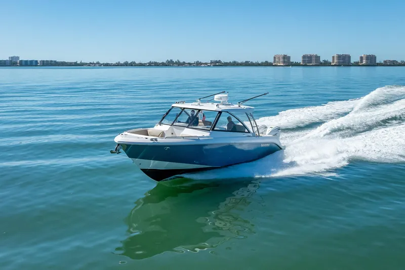Kashmir Yacht Photos Pics 2019 Everglades 340 Dual Console boat cruising on calm blue waters.