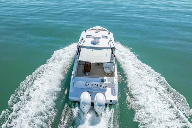 Kashmir Yacht Photos Pics 2019 Everglades 340 Dual Console boat cruising on clear blue water.