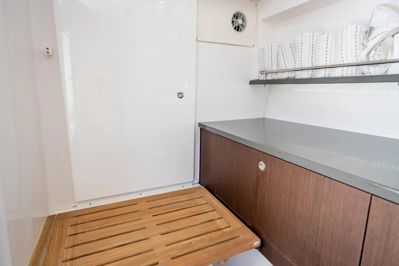 Kashmir Yacht Photos Pics Interior of 2019 Everglades 340 Dual Console boat with wooden flooring and sleek cabinetry.