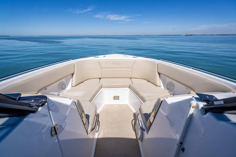 Kashmir Yacht Photos Pics 2019 Everglades 340 Dual Console boat interior with beige seating on calm water.