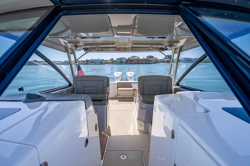 Kashmir Yacht Photos Pics 2019 Everglades 340 Dual Console boat interior with lake view and American flag.
