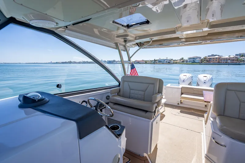 Kashmir Yacht Photos Pics Interior view of 2019 Everglades 340 Dual Console boat on calm water.