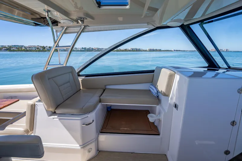 Kashmir Yacht Photos Pics Interior of 2019 Everglades 340 Dual Console boat with seating and ocean view.
