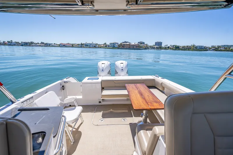 Kashmir Yacht Photos Pics 2019 Everglades 340 Dual Console boat interior with scenic waterfront view.