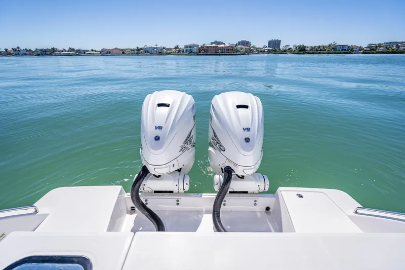 Kashmir Yacht Photos Pics 2019 Everglades 340 Dual Console boat with twin V8 engines on calm water.
