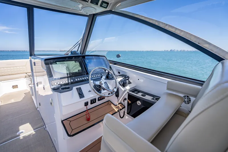 Kashmir Yacht Photos Pics 2019 Everglades 340 Dual Console boat interior with modern dashboard and ocean view.