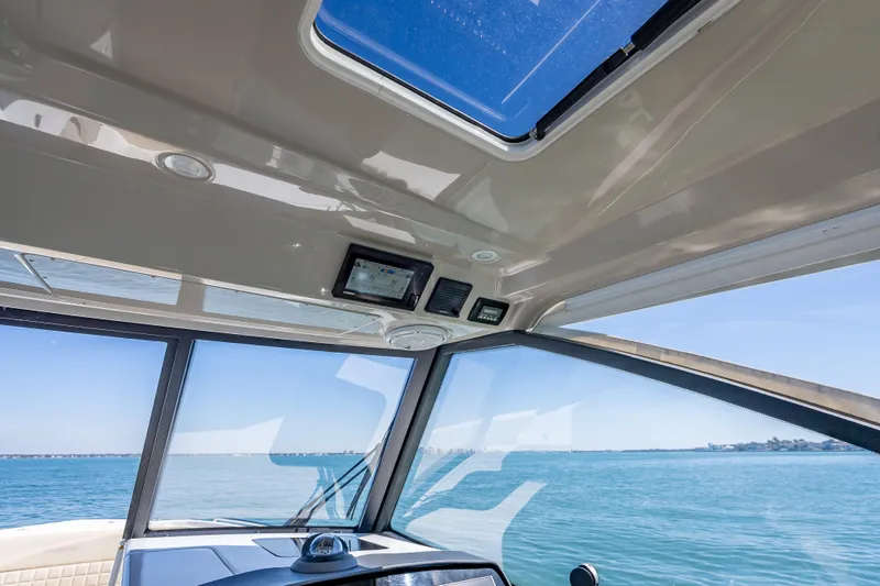 Kashmir Yacht Photos Pics Interior view of 2019 Everglades 340 Dual Console boat with ocean backdrop.