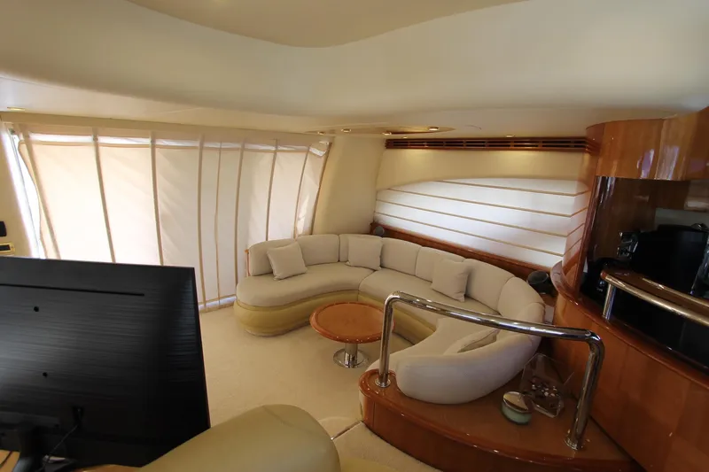 Sevrik Yacht Photos Pics Luxurious interior of a 2004 Azimut 62 yacht with elegant seating and modern design.
