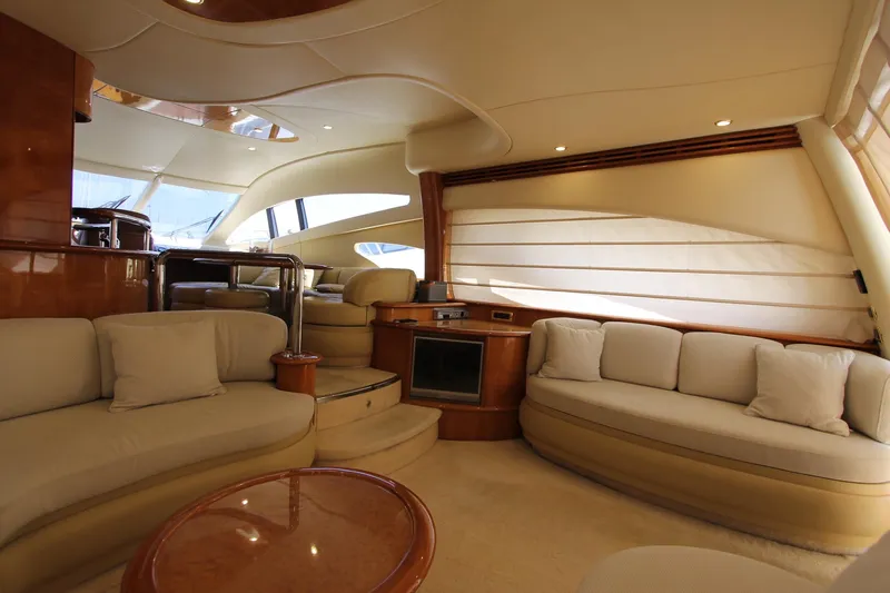 Sevrik Yacht Photos Pics Luxurious interior of a 2004 Azimut 62 yacht with elegant seating and modern design.