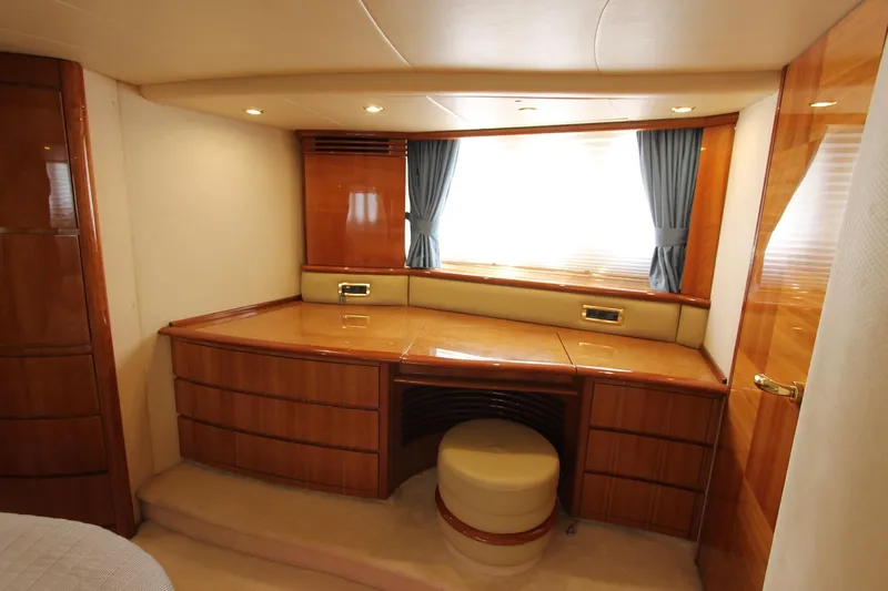 Sevrik Yacht Photos Pics Luxurious interior of a 2004 Azimut 62 yacht with elegant wood finish and seating.