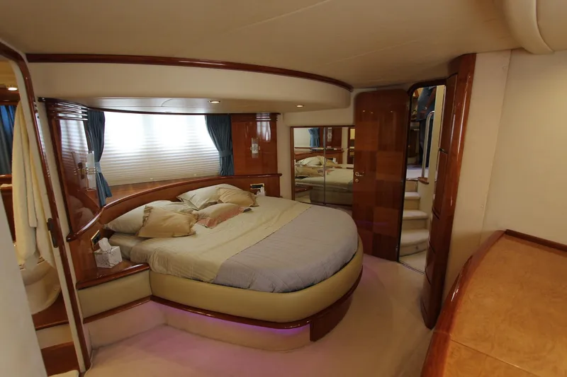 Sevrik Yacht Photos Pics Luxurious interior of a 2004 Azimut 62 yacht with elegant bedroom design.