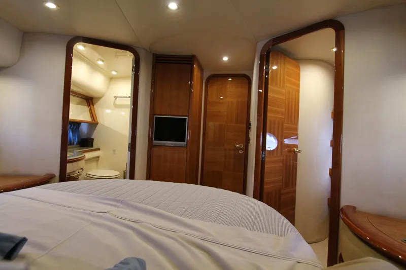 Sevrik Yacht Photos Pics Luxurious interior of a 2004 Azimut 62 yacht with wood finishes and modern amenities.