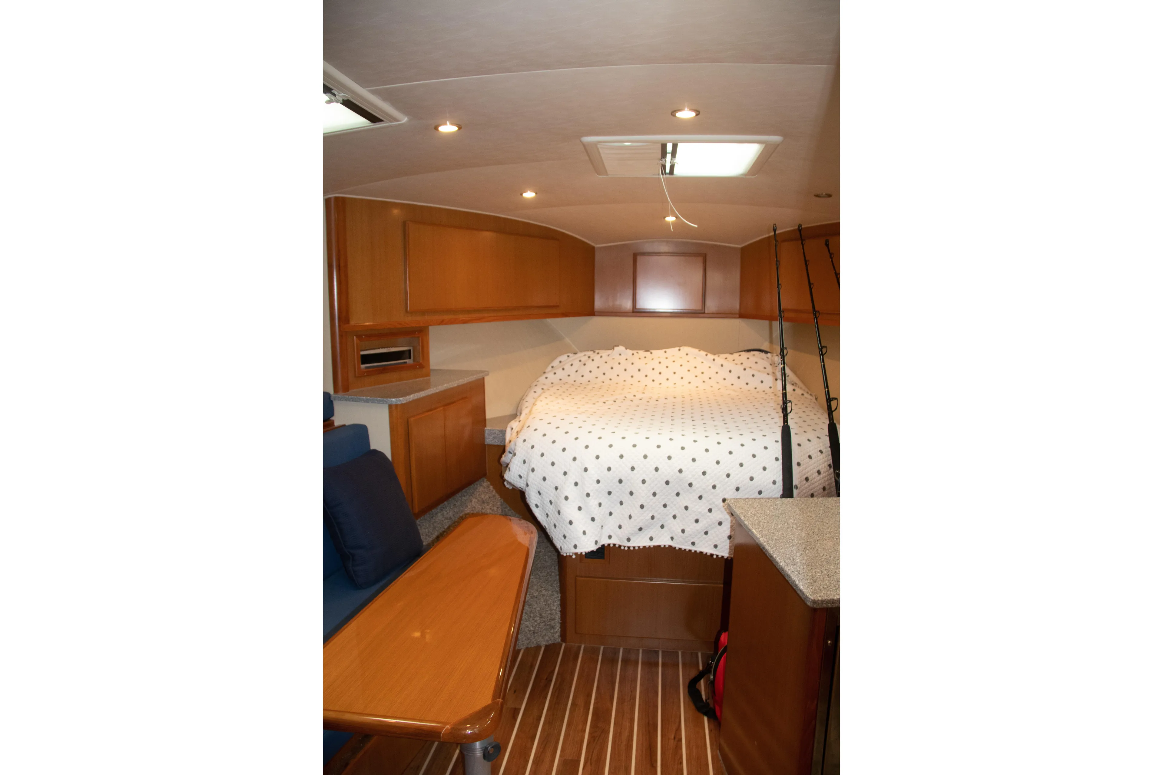 Peixe Espada Yacht Photos Pics Interior of 2016 Henriques 42 Express Hardtop with cozy cabin and wooden furnishings.