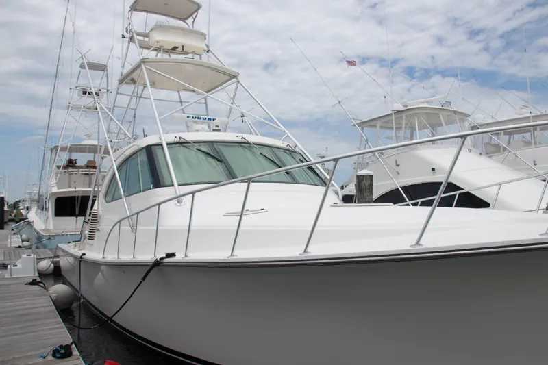 Peixe Espada Yacht Photos Pics 2016 Henriques 42 Express Hardtop yacht docked at marina under cloudy sky.