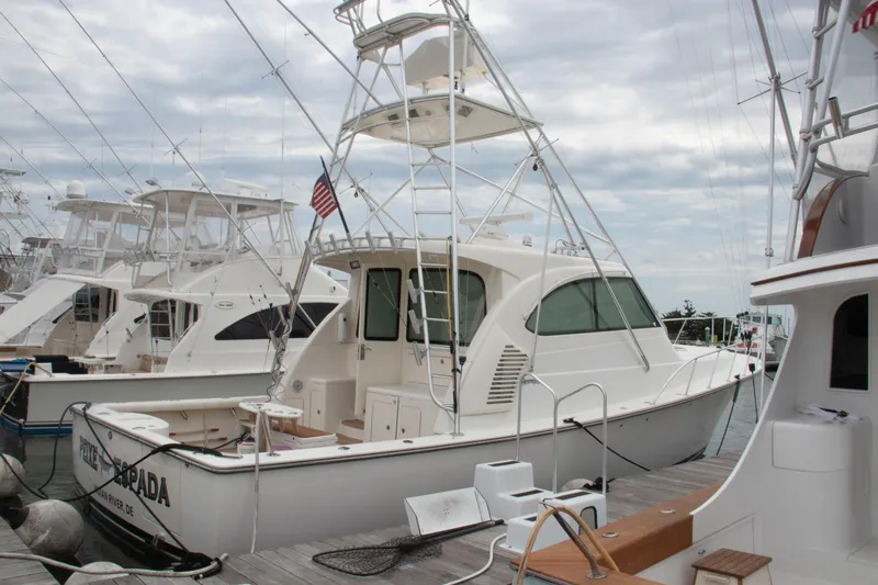 Peixe Espada Yacht Photos Pics 2016 Henriques 42 Express Hardtop docked at marina, surrounded by other boats.