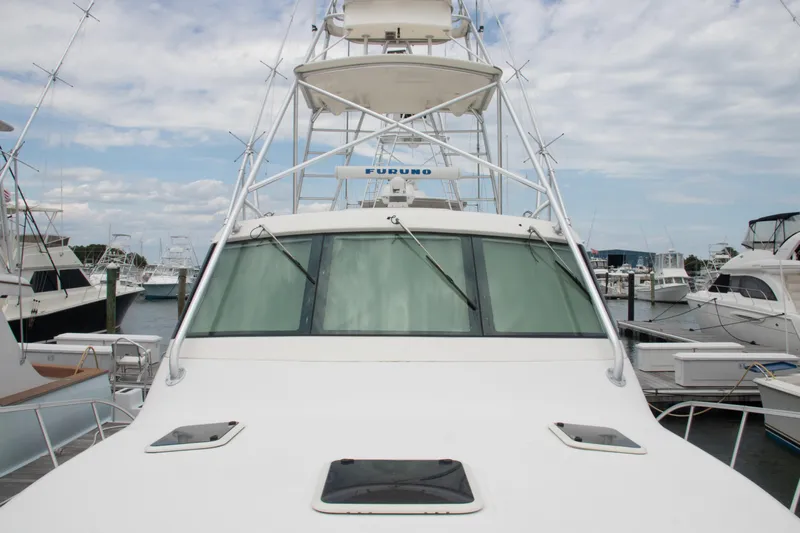 Peixe Espada Yacht Photos Pics 2016 Henriques 42 Express Hardtop boat docked at marina, front view.