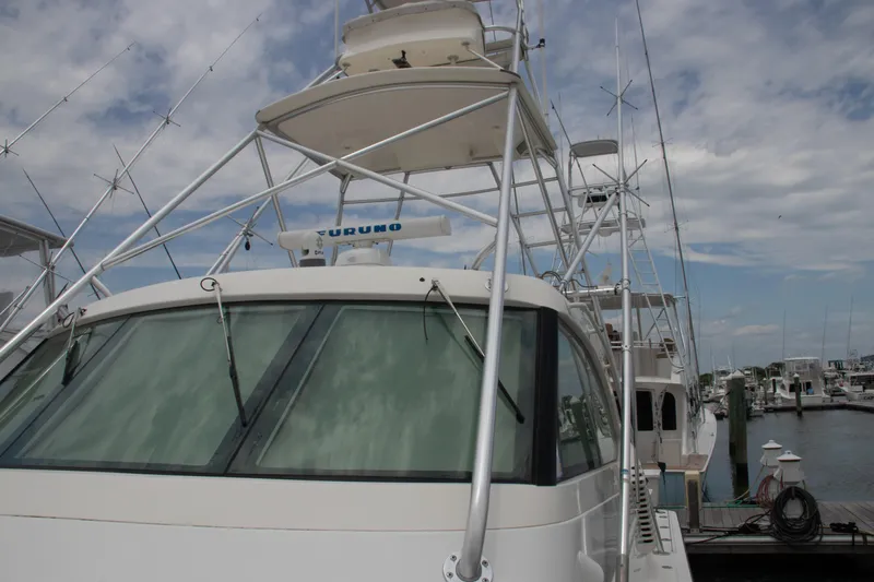 Peixe Espada Yacht Photos Pics 2016 Henriques 42 Express Hardtop boat docked, featuring a hardtop and fishing equipment.