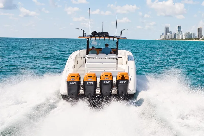  Yacht Photos Pics 2016 Midnight Express 43' Open boat cruising with four engines on open water.