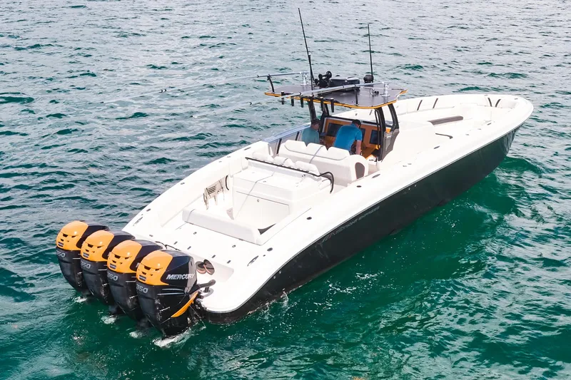  Yacht Photos Pics 2016 Midnight Express 43' Open boat with four Mercury outboard engines on the water.