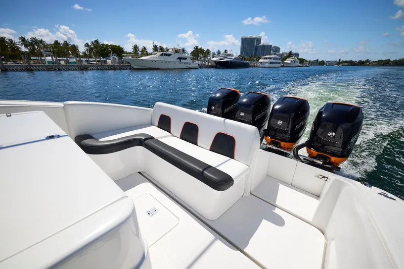  Yacht Photos Pics 2016 Midnight Express 43' Open boat with four powerful outboard engines on a sunny day.