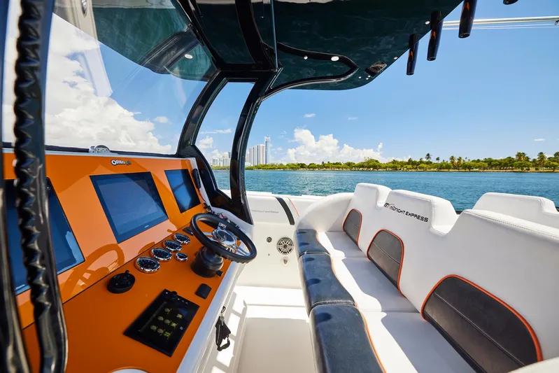  Yacht Photos Pics Interior view of 2016 Midnight Express 43' Open boat with modern dashboard and seating.