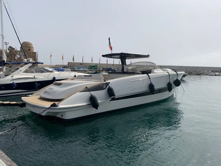 Zuma Yacht Photos Pics 2021 Solaris Power 48 yacht docked in a marina, featuring sleek design and modern amenities.