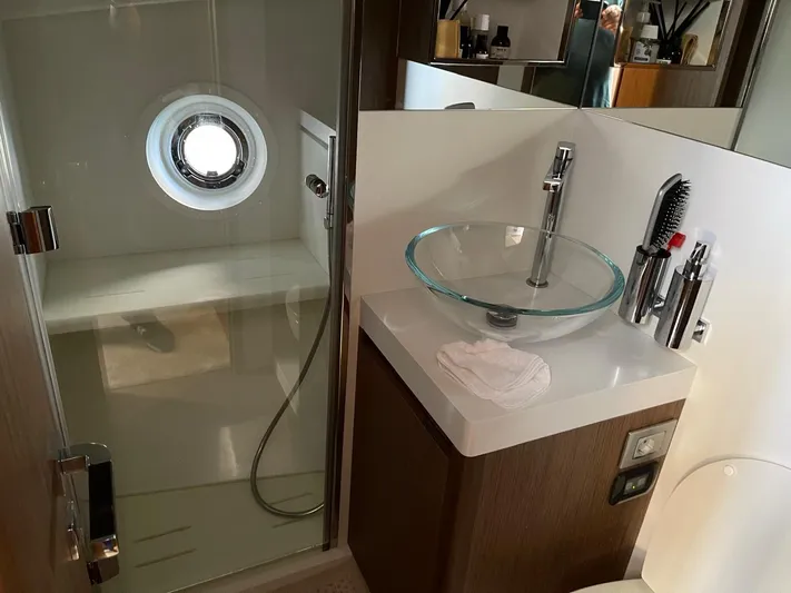 Zuma Yacht Photos Pics Modern bathroom in 2021 Solaris Power 48 yacht with glass sink and shower.