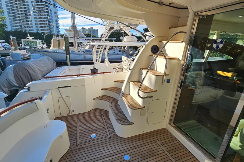 Kopara Yacht Photos Pics Luxury 2005 Prestige 46 yacht with elegant wooden deck and spiral staircase.
