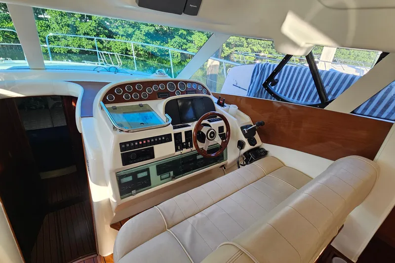 Kopara Yacht Photos Pics 2005 Prestige 46 yacht cockpit with modern controls and leather seating.