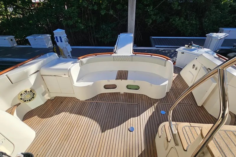 Kopara Yacht Photos Pics Prestige 46 yacht deck, 2005 model, featuring wooden flooring and white seating area.