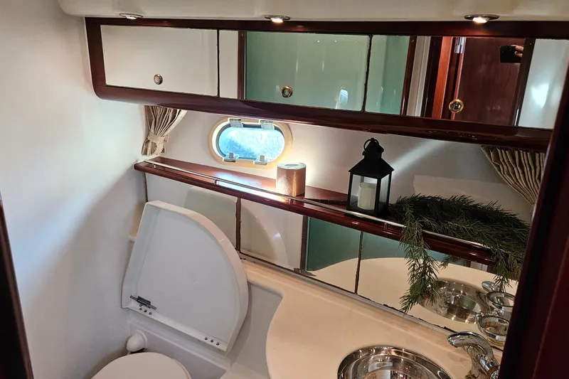 Kopara Yacht Photos Pics Luxurious bathroom interior of 2005 Prestige 46 yacht with elegant decor and fixtures.