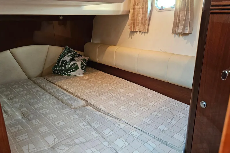 Kopara Yacht Photos Pics Cozy cabin interior of 2005 Prestige 46 yacht with bed and decorative pillow.