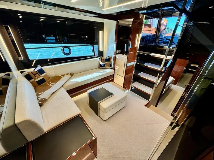 Grey Yacht Photos Pics Luxurious interior of 2021 Riva 56 Rivale yacht with modern seating and elegant design.