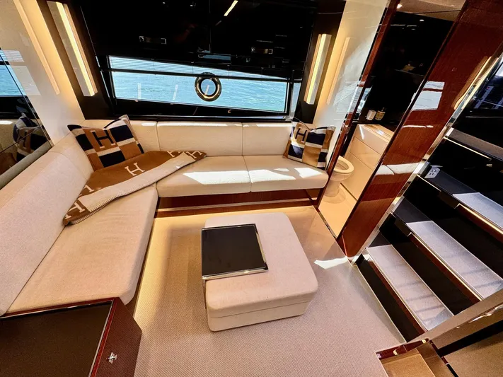 Grey Yacht Photos Pics Luxurious interior of 2021 Riva 56 Rivale yacht with elegant seating and modern design.