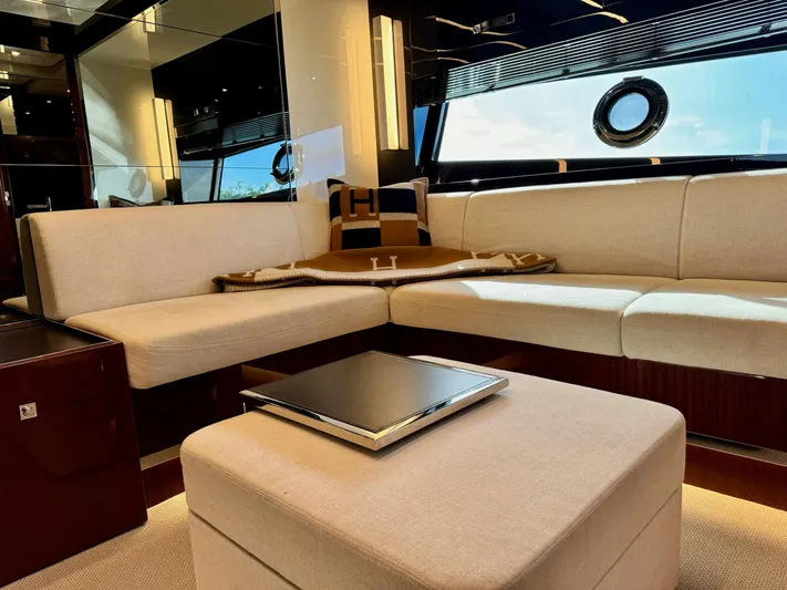 Grey Yacht Photos Pics Luxurious interior of 2021 Riva 56 Rivale yacht with elegant beige seating and modern decor.