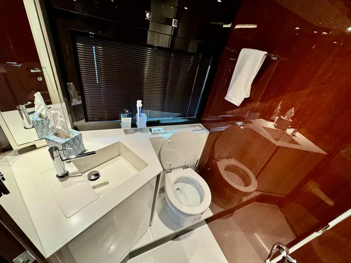 Grey Yacht Photos Pics Luxurious bathroom interior of 2021 Riva 56 Rivale yacht with modern fixtures.