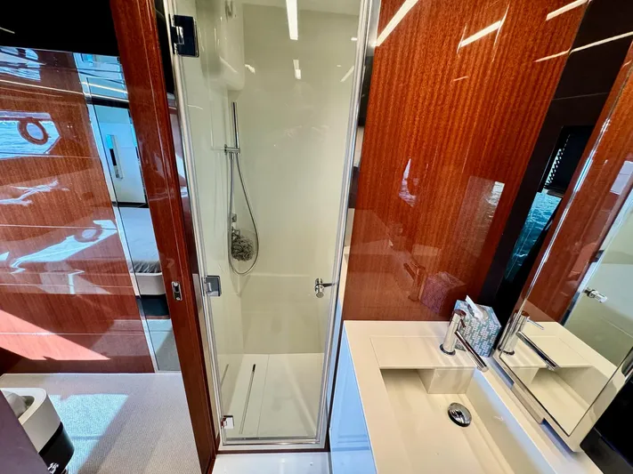 Grey Yacht Photos Pics Luxurious bathroom interior of 2021 Riva 56 Rivale yacht with modern shower and sleek design.